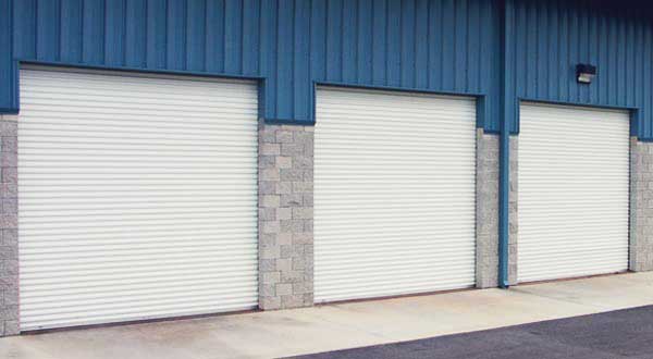 Wind-resistant specialty door for industrial building