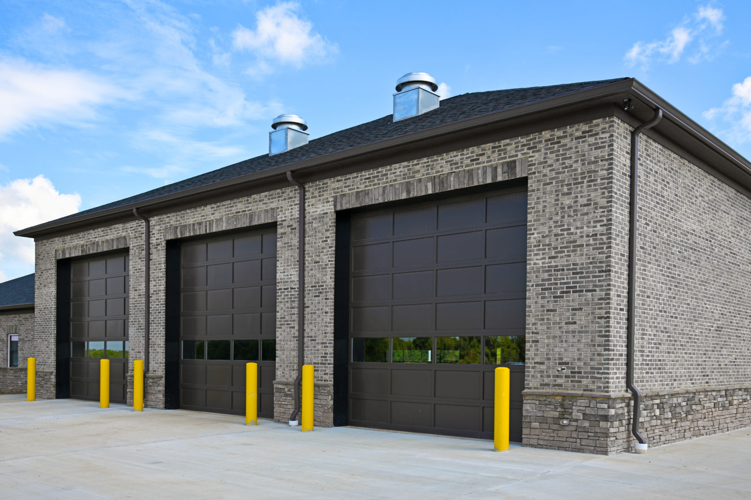 Steel sectional overhead doors for retail storefront