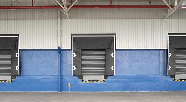 Commercial dock leveler installed at loading bay