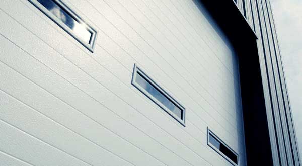 White aluminum sectional door with windows